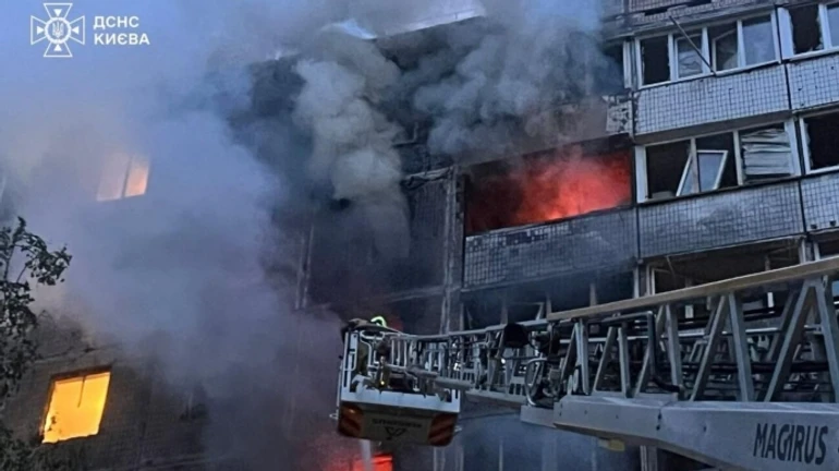 Two people killed and eight injured, including four children, in Russian attack on Kyiv – photos