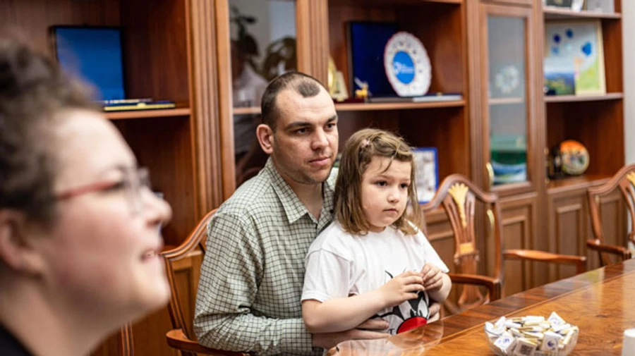 Ukrainian child whose parents were captured defending Mariupol returns home 