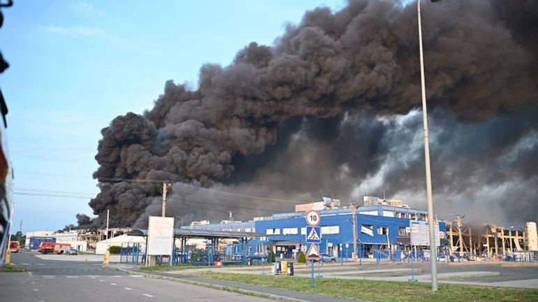 Firefighters continue to battle blaze in Mukachevo after Russian missile strike – video