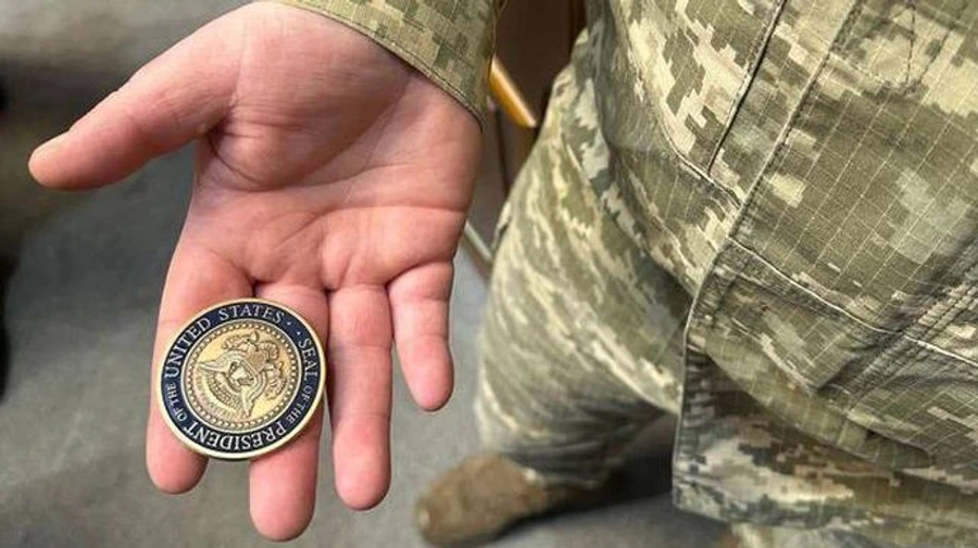 Zelenskyy passes Command Coin from Biden to commander of HIMARS multiple rocket launcher battery