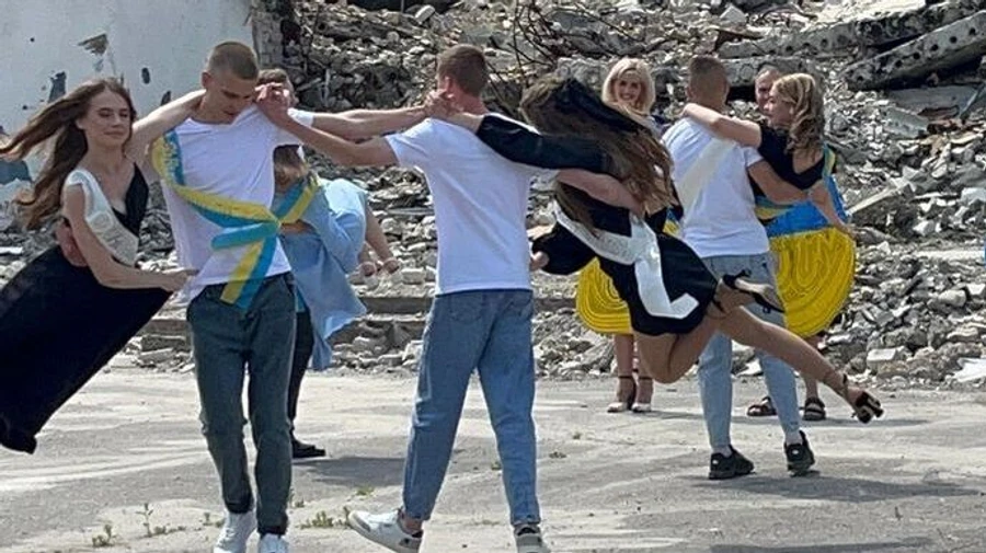 School graduates dance sombre waltz on ruins of House of Arts in Kharkiv Oblast