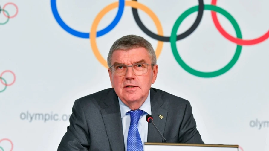 International Olympic Committee pressures skiing and biathlon federations to allow Russian athletes to compete