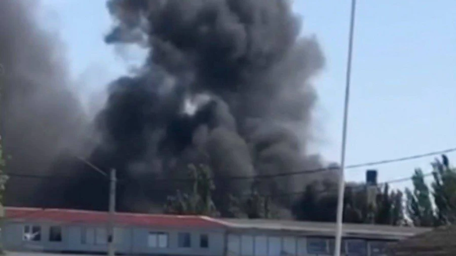 Workshop in Berdiansk where Russians bring military equipment on fire