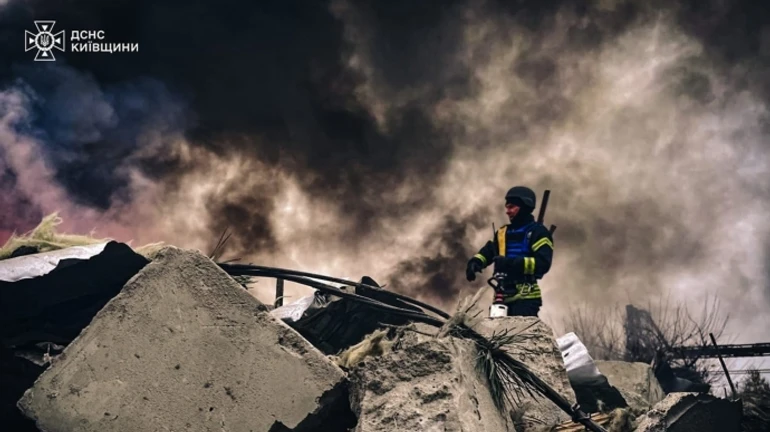 Russians attack Kyiv and Kyiv Oblast with missiles and UAVs: person injured by drone wreckage, warehouse on fire – photos