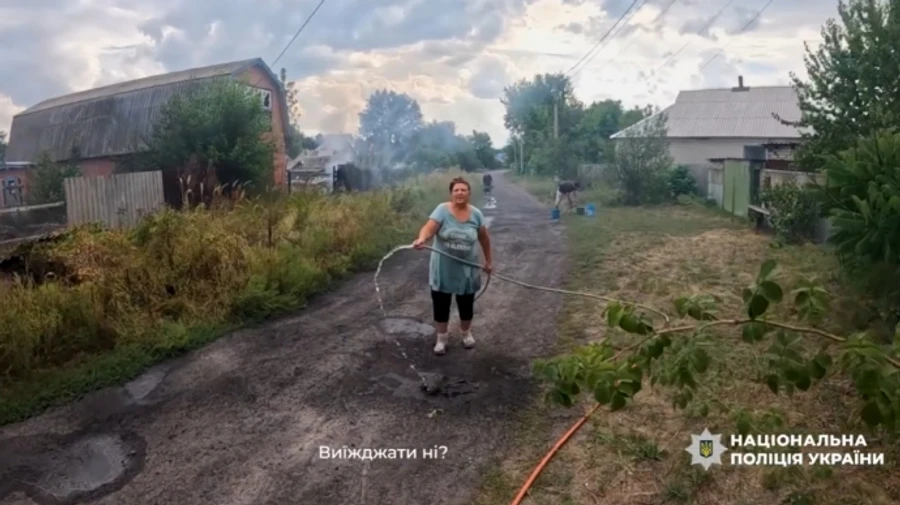 Ukrainian police post video of evacuation from Yarova, where Russians killed 25 civilians, amid fire