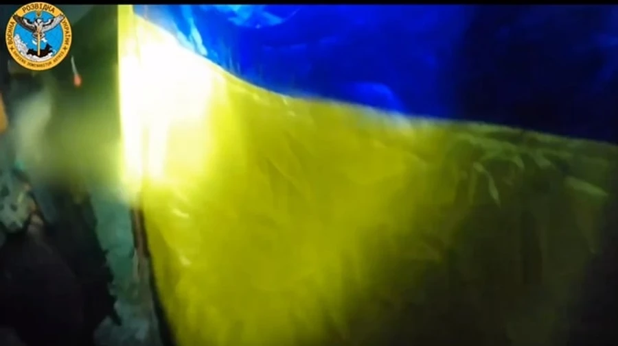 Ukrainian flag flies at night in occupied Crimea
