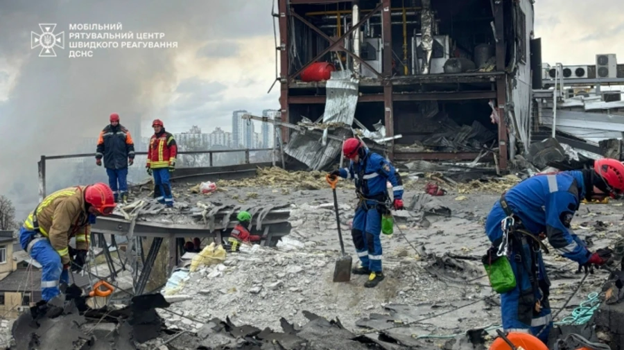 Debris still being cleared in Kyiv nearly 10 hours after Russian missile strike – photos