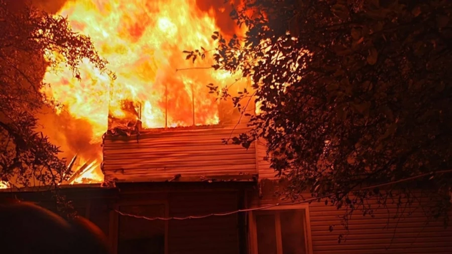 Russian drone attack on Kyiv Oblast sets houses on fire, injures man – photos