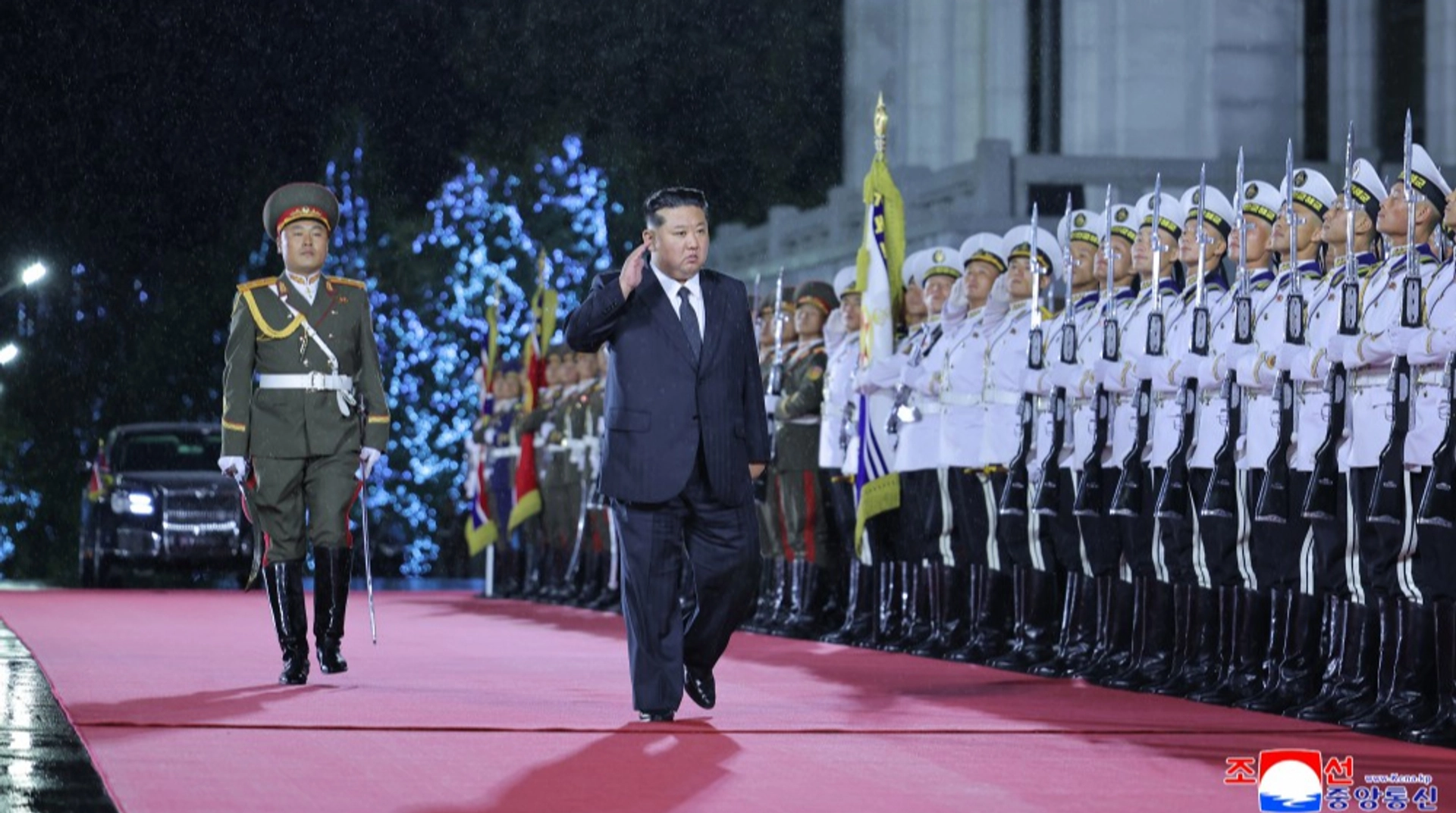 North Korean leader stages military parade, shows off new missile