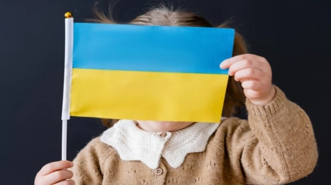 Four children evacuated from Russian-occupied Kherson, including boy targeted for military service