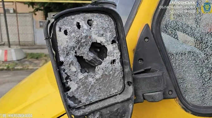 Russian drone hits car and fixed-route minibus in Kherson, killing one person and injuring nine – video