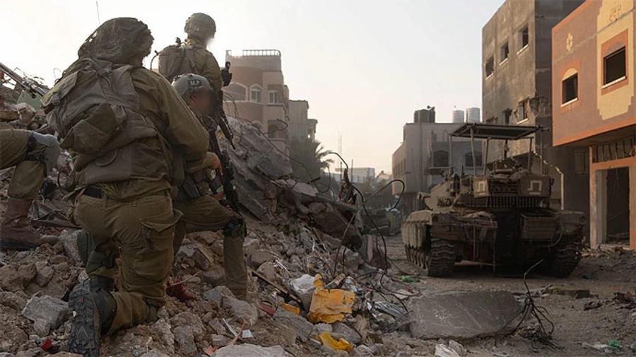 Israeli forces capture Hamas stronghold in Gaza and attack 450 targets