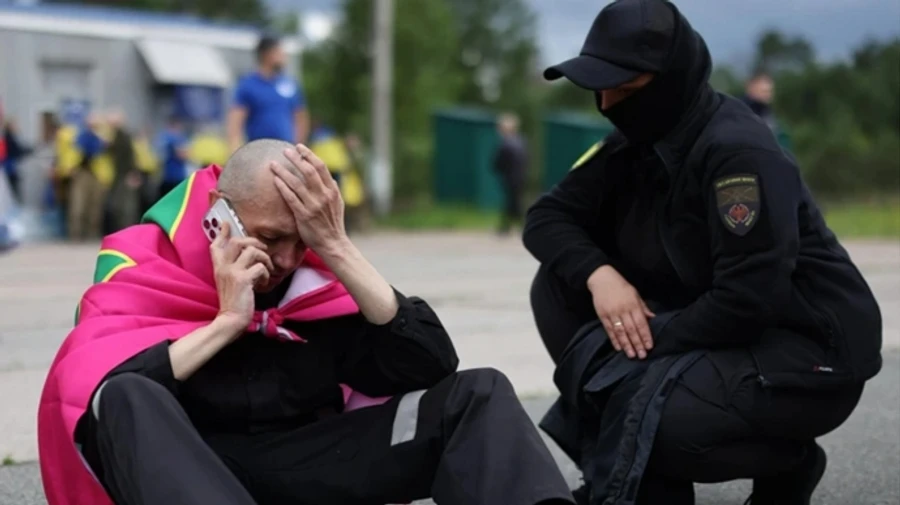 My socks made it through: Ukrainian border guard shows off socks with service logo that survived his time in Russian captivity – video