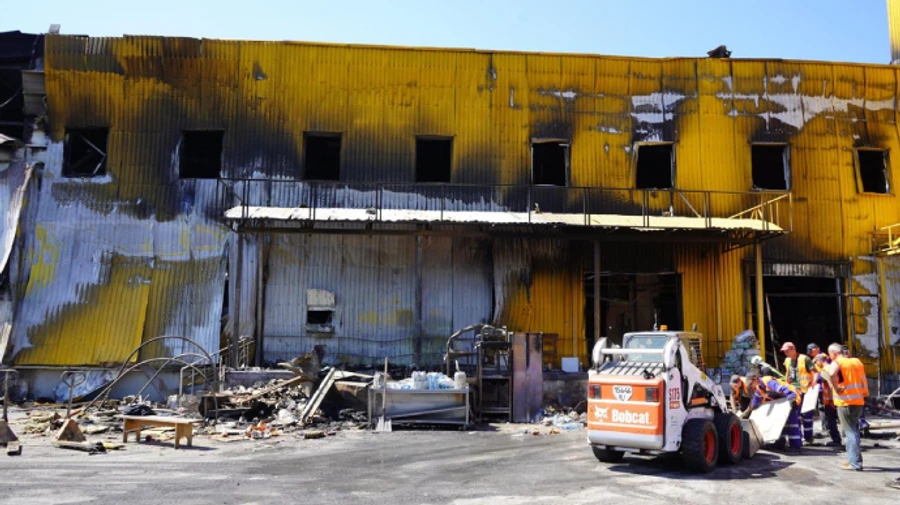 Slab shifts during rubble clearance at Kremenchuh shopping centre, hospitalising two rescuers