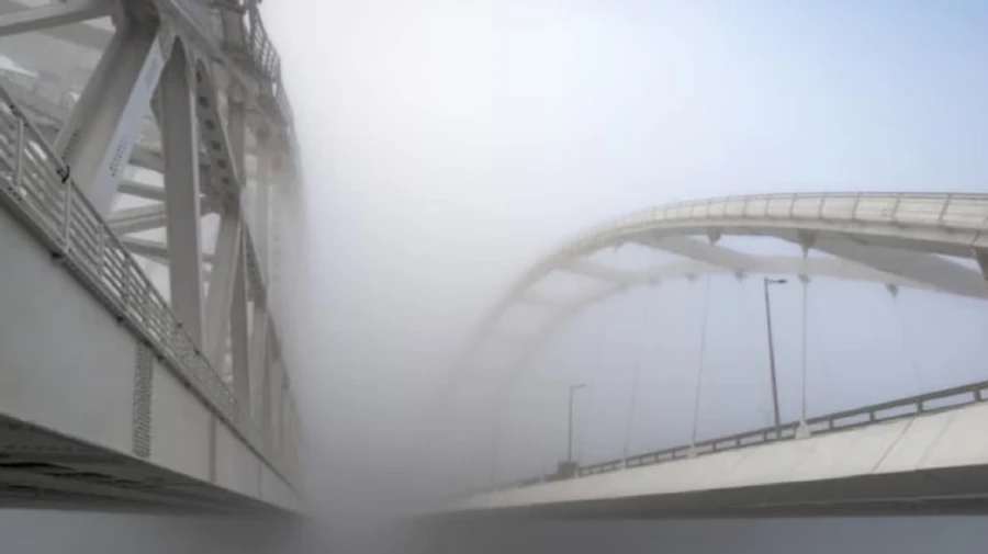 Crimean Bridge covered with smoke screen, traffic stopped