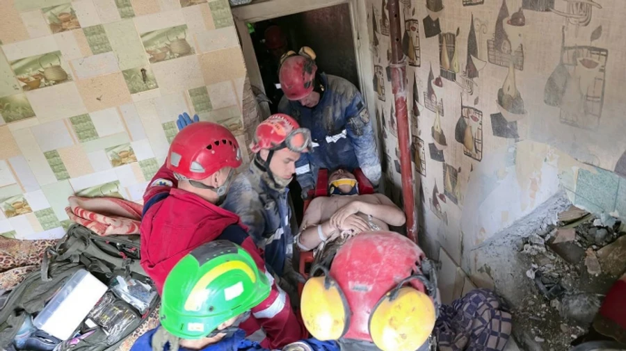 Emergency workers in Kyiv rescue man alive from under rubble – photos