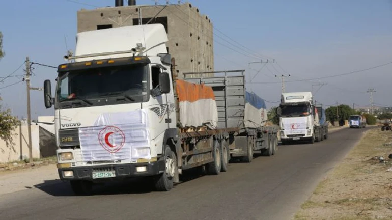 First trucks carrying humanitarian aid enter Gaza Strip, but no foreign citizens were permitted to leave