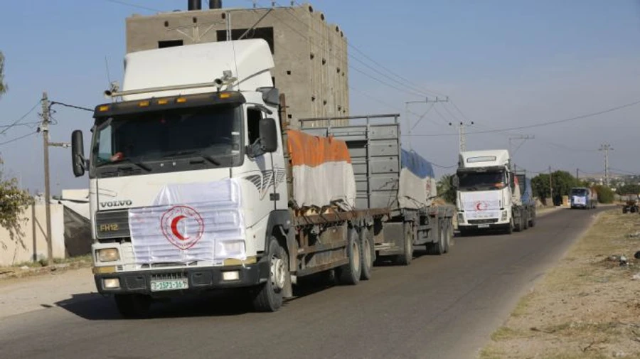 First trucks carrying humanitarian aid enter Gaza Strip, but no foreign citizens were permitted to leave