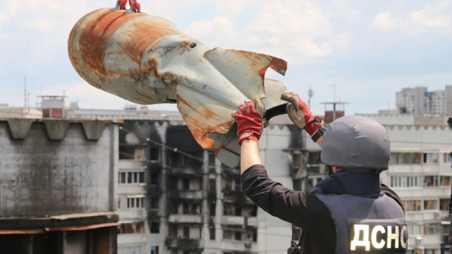 Heavy-duty Russian bomb is removed from the roof of a nine-story building in Kharkiv