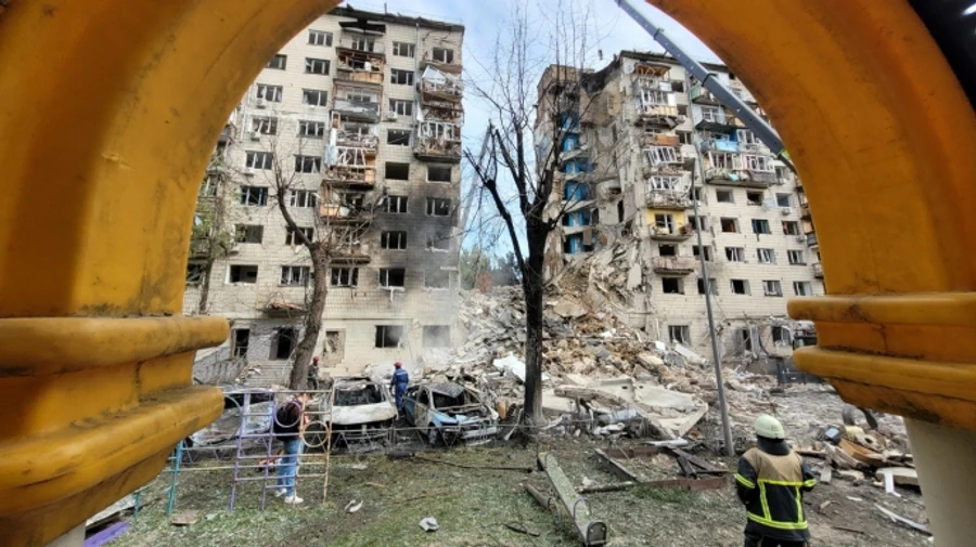 Between 4 and 14 people may be trapped under rubble of Kyiv building