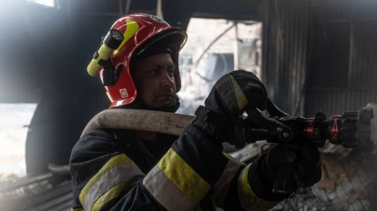 Firefighting operation ongoing in Kyiv after overnight Russian attack – video, photos