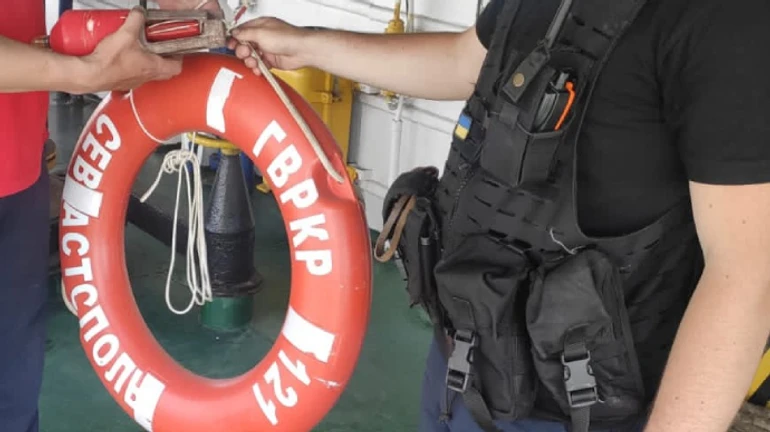 Lifebuoy and lighted buoy from sunken Moskva cruiser are pulled out of the sea