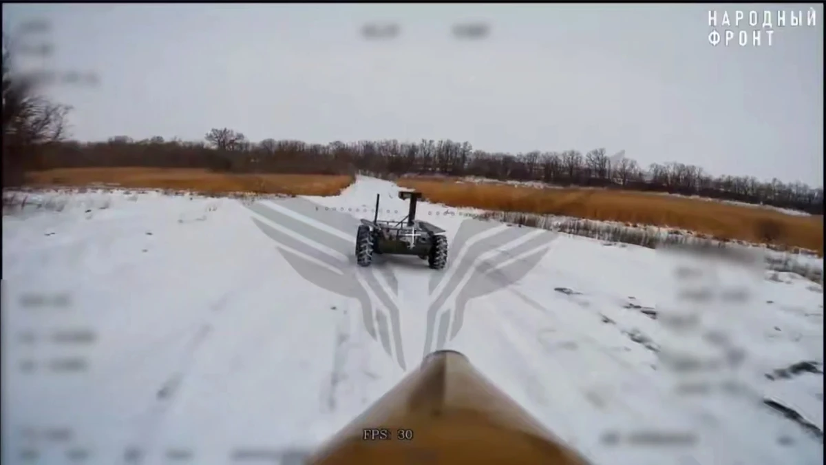 A Ukrainian ground robot seen through the lens of a drone operator from Russia's Rubicon unit