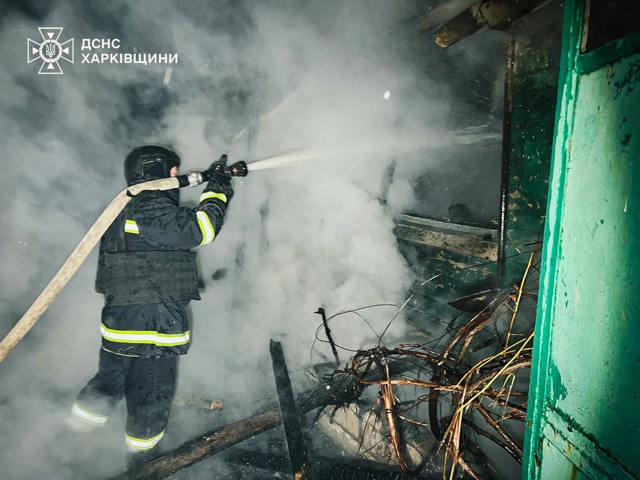 A firefighter extinguishes a fire. Photo: State Emergency Service of Ukraine in Kharkiv Oblast