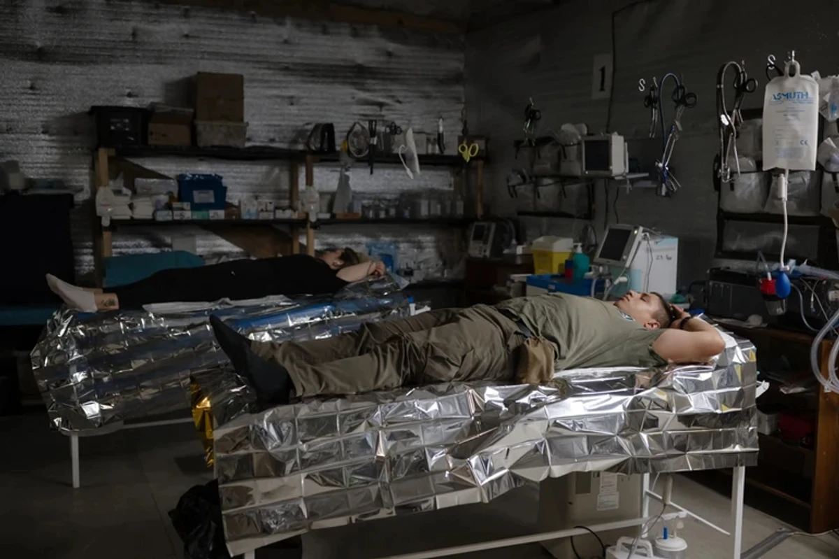Soldiers sleeping in a mobile operation room.