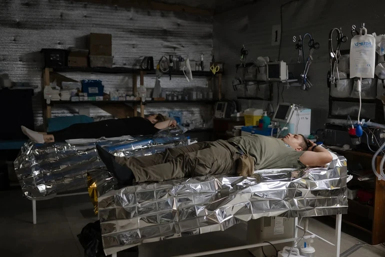 Soldiers sleeping in a mobile operation room.