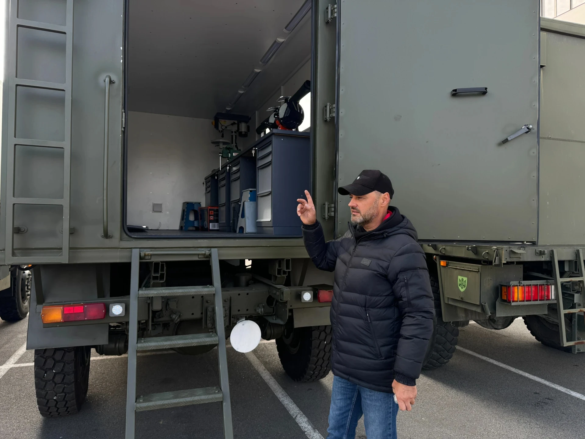 Serhii Kosenko, chief designer at Sprava Hromad, demonstrates the first version of the mobile repair workshop.