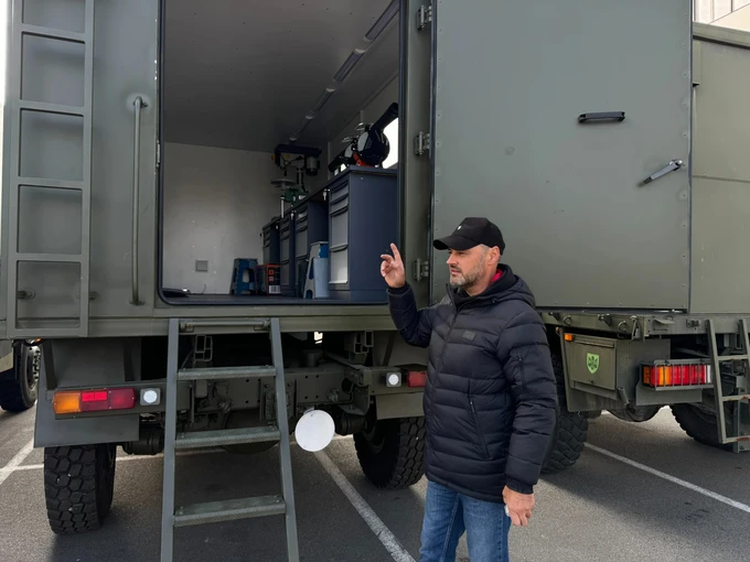 Serhii Kosenko, chief designer at Sprava Hromad, demonstrates the first version of the mobile repair workshop.