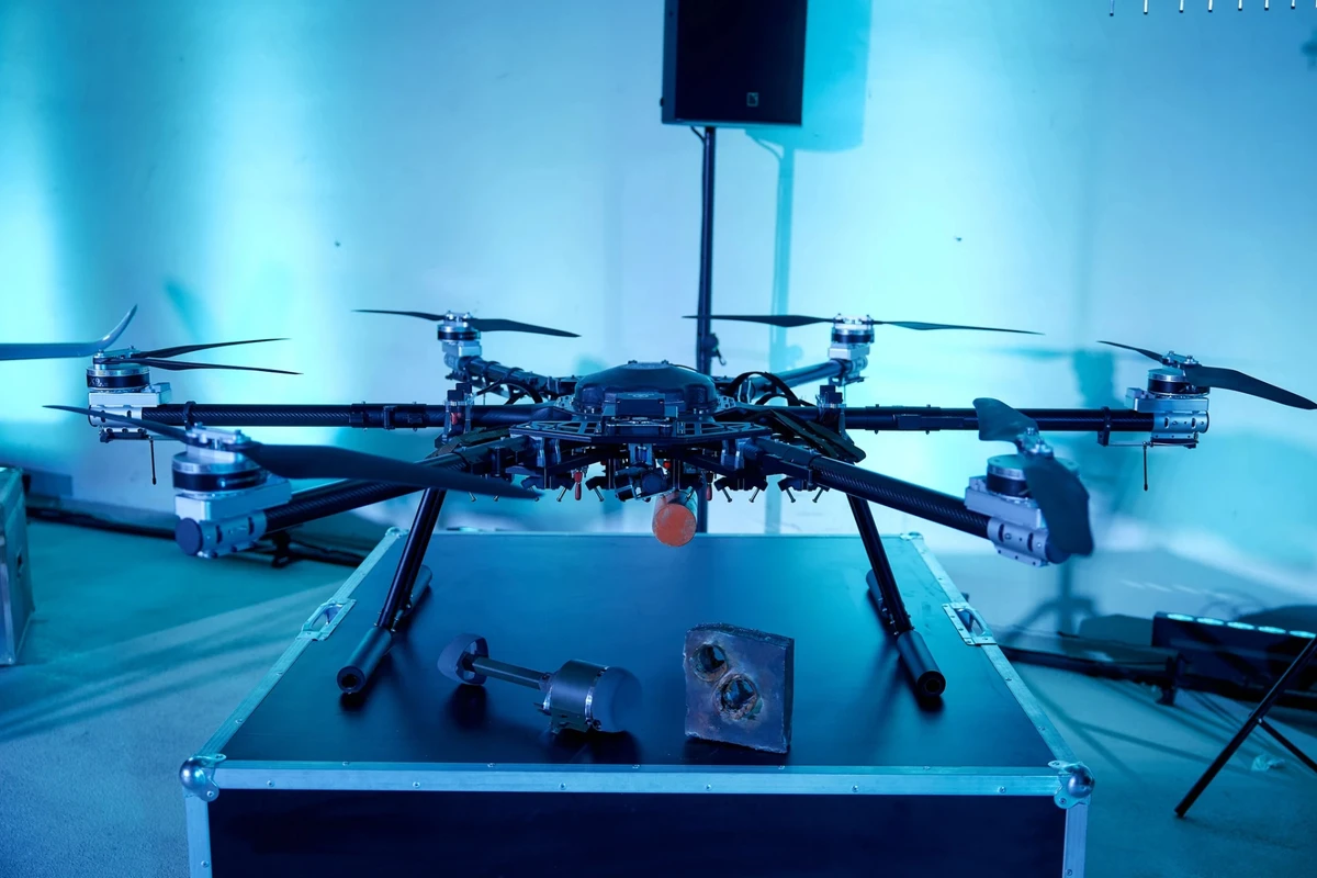 A Ukrainian bomber drone with suspended munitions and examples of their armour penetration.