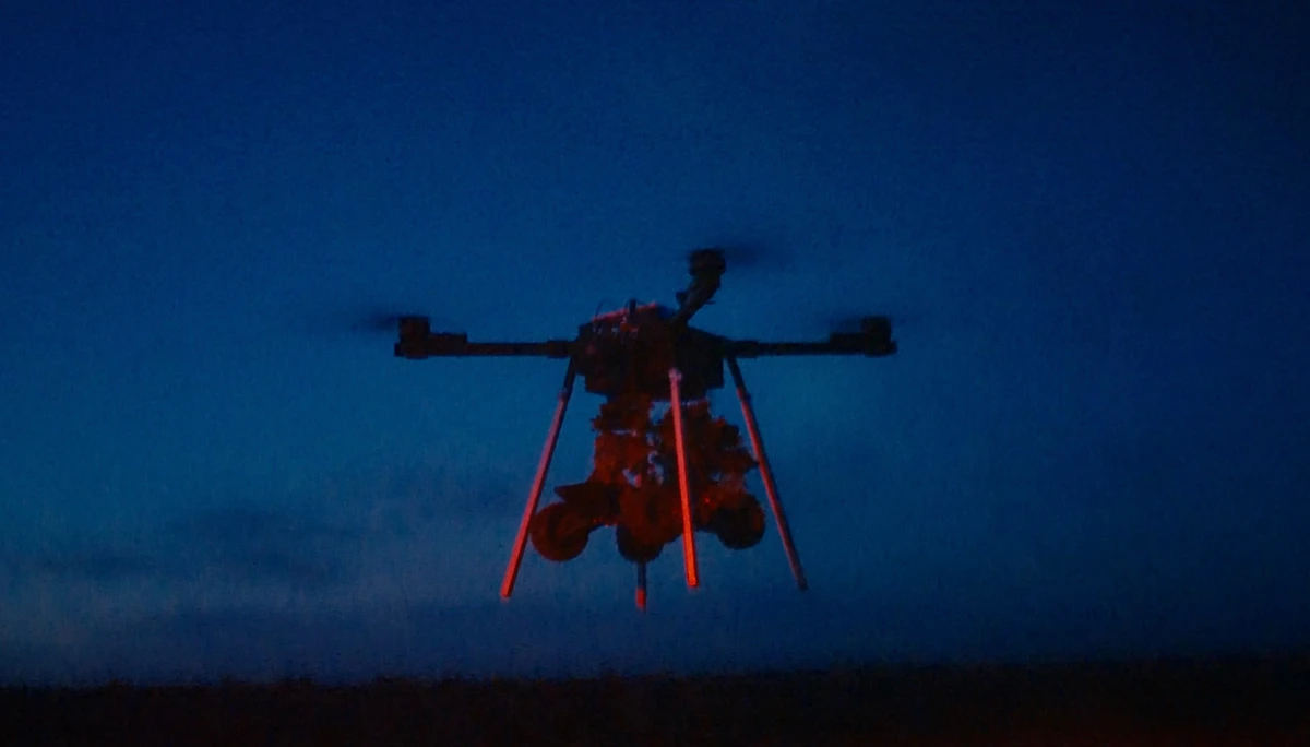 Combat unmanned ground vehicle (UGV) attached to a drone