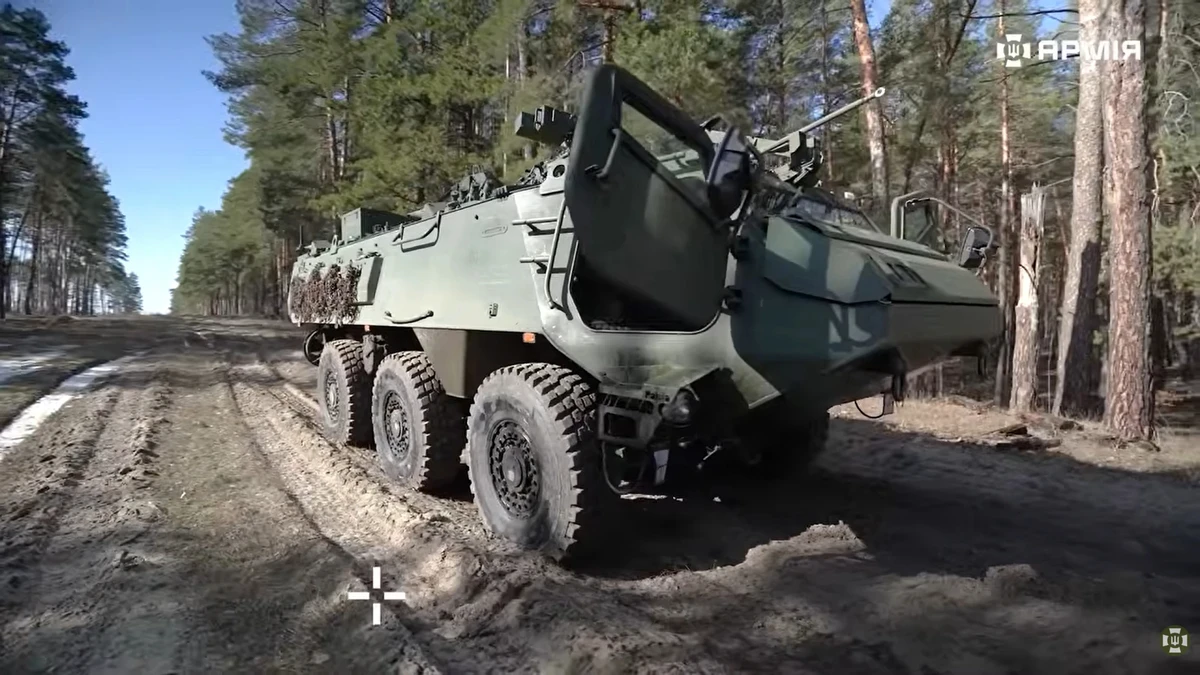 Patria 6×6 moving across rough terrain.