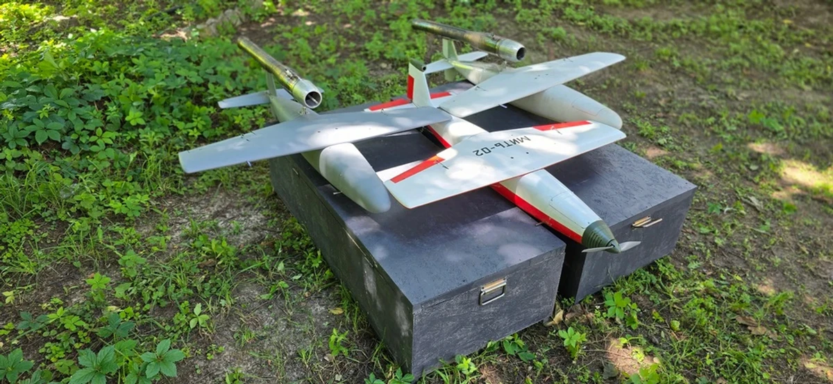 Three fixed-wing UAVs: two fitted with a pulsejet engine and one with an electric motor for testing.