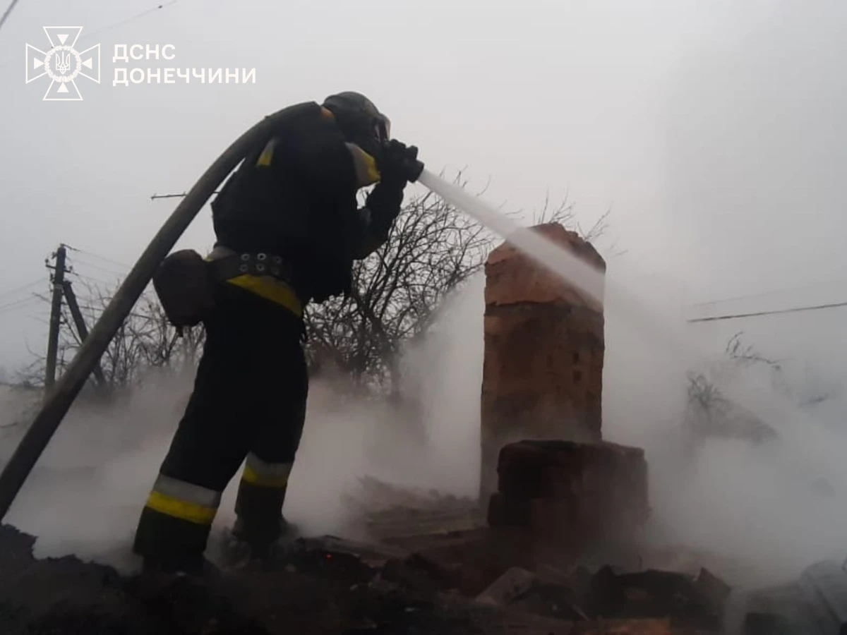 A firefighter extinguishing a fire.