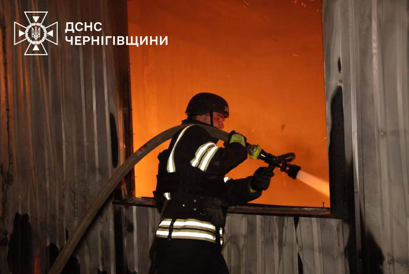Firefighter extinguishing fire