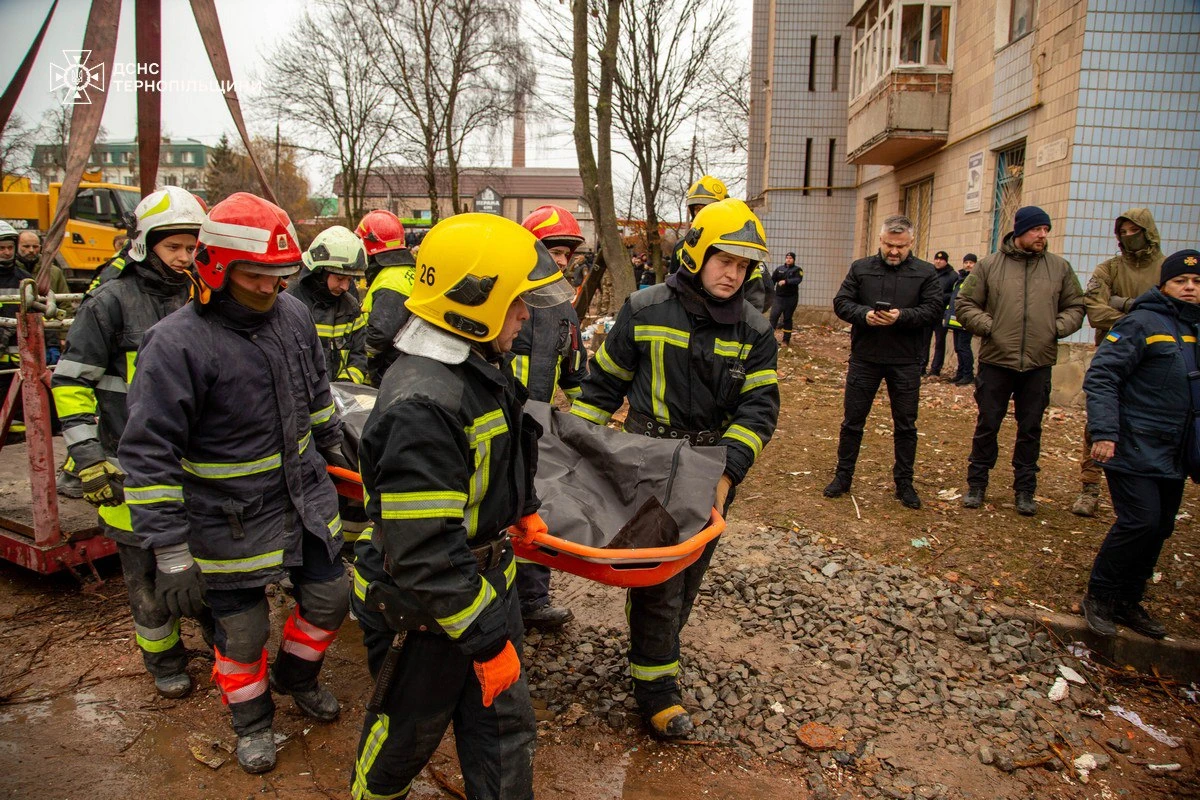 Emergency service employees working at the site of the Russian strike on a residential building in Ternopil, Ukraine, on November 19, 2025.