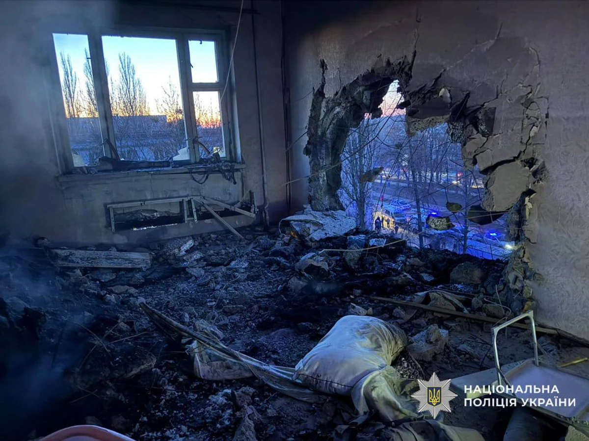 A devastated flat is strewn with rubble after an explosion tore a large hole through the wall