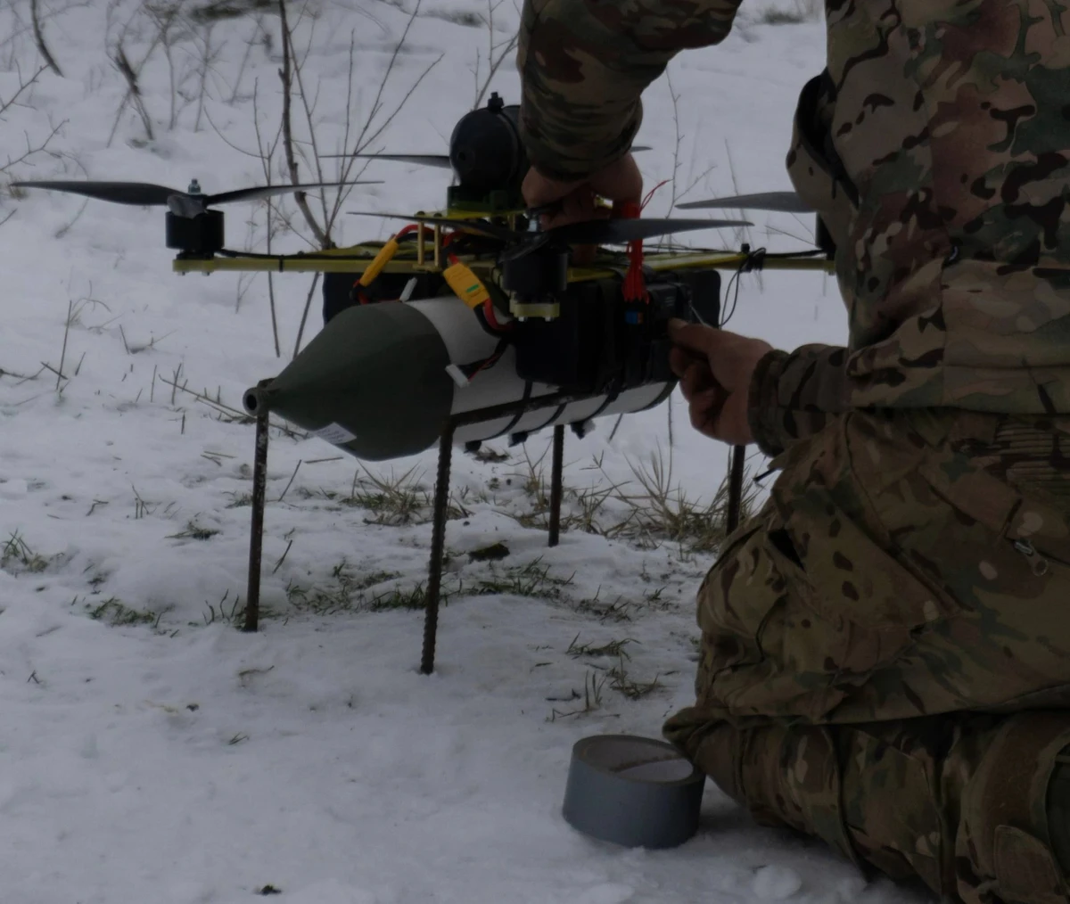 Preparing a fibre-optic drone for flight.