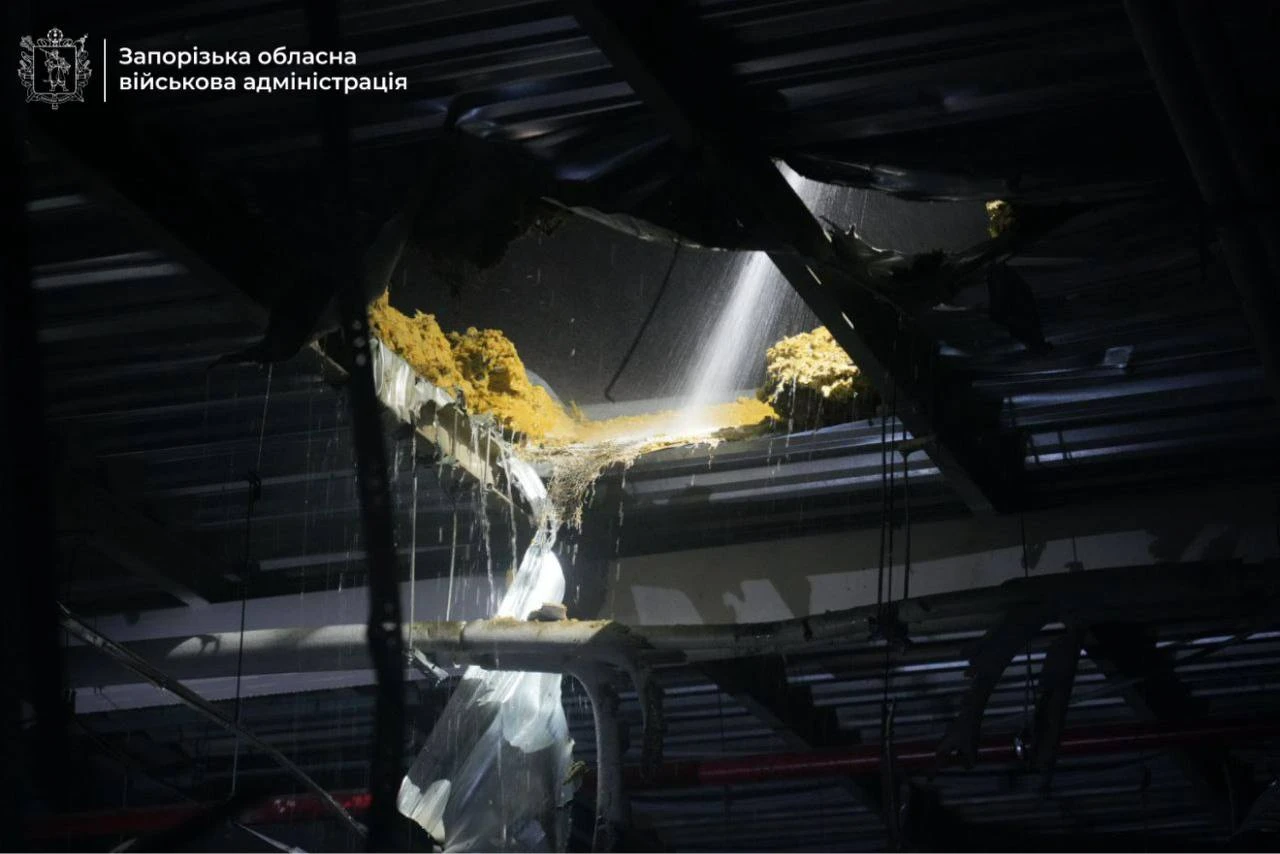 A jagged hole in a damaged roof.