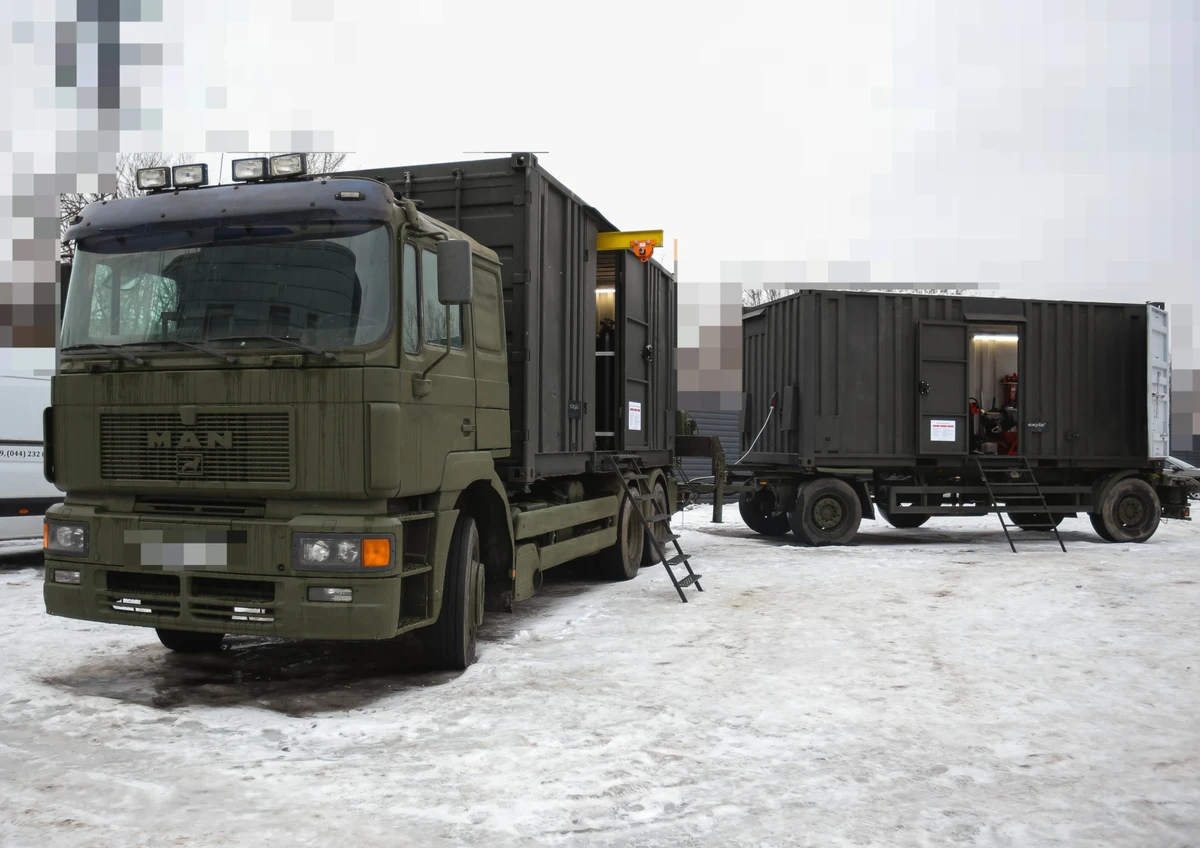 A mobile technical workshop on a MAN chassis, complete with a tyre repair unit on a trailer in the 43rd Artillery Brigade