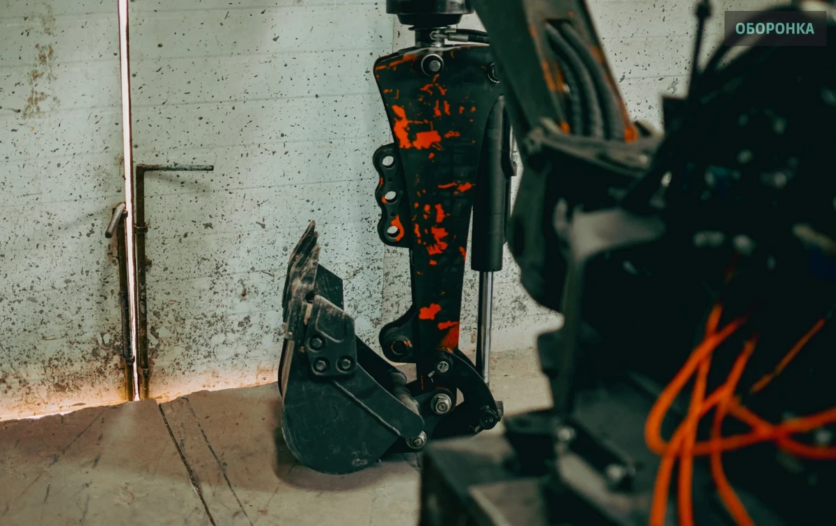 A GRS fitted with a manipulator and excavator bucket for building positions in areas affected by Russian drones