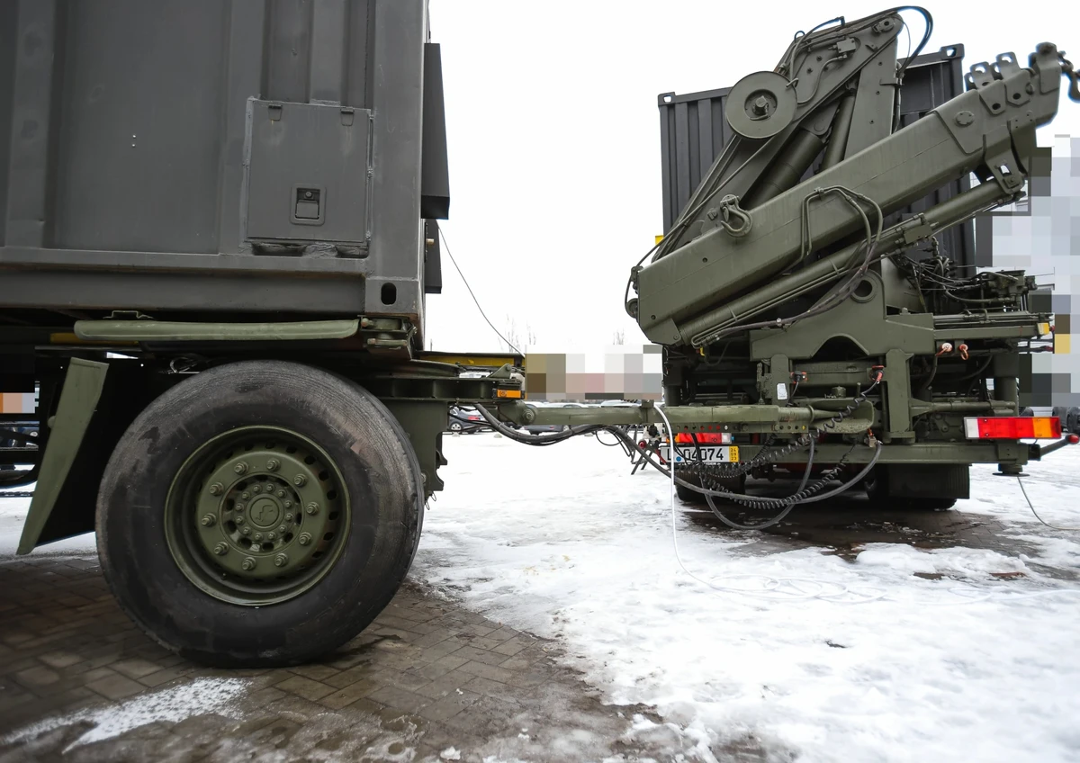Mobile repair workshop with tyre-fitting unit and loader crane in the 43rd Artillery Brigade.