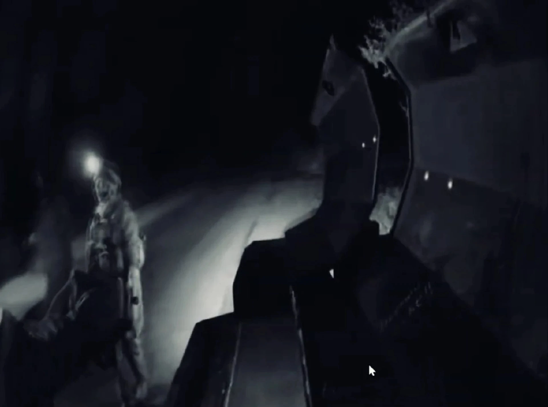 Soldiers transferring the wounded from the robot to the armoured vehicle