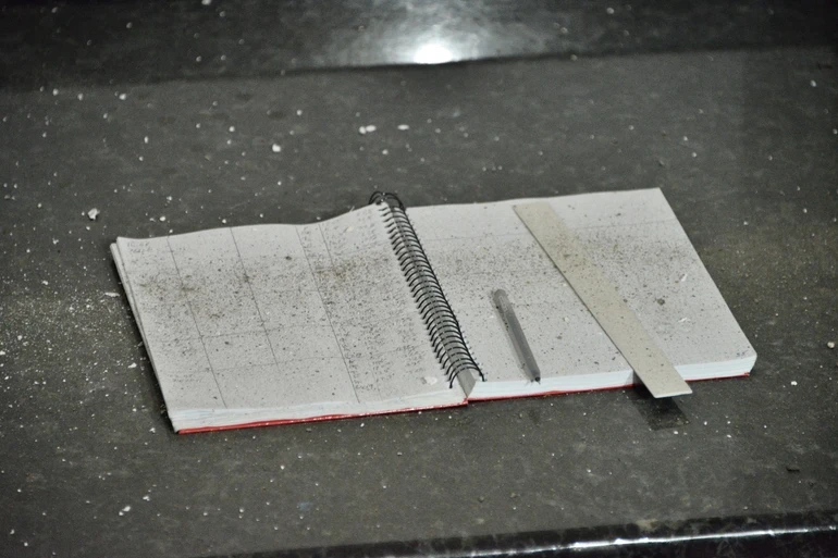 A notebook covered with dust and debris at the Kyiv-Pechersk Lavra following the Russian strike