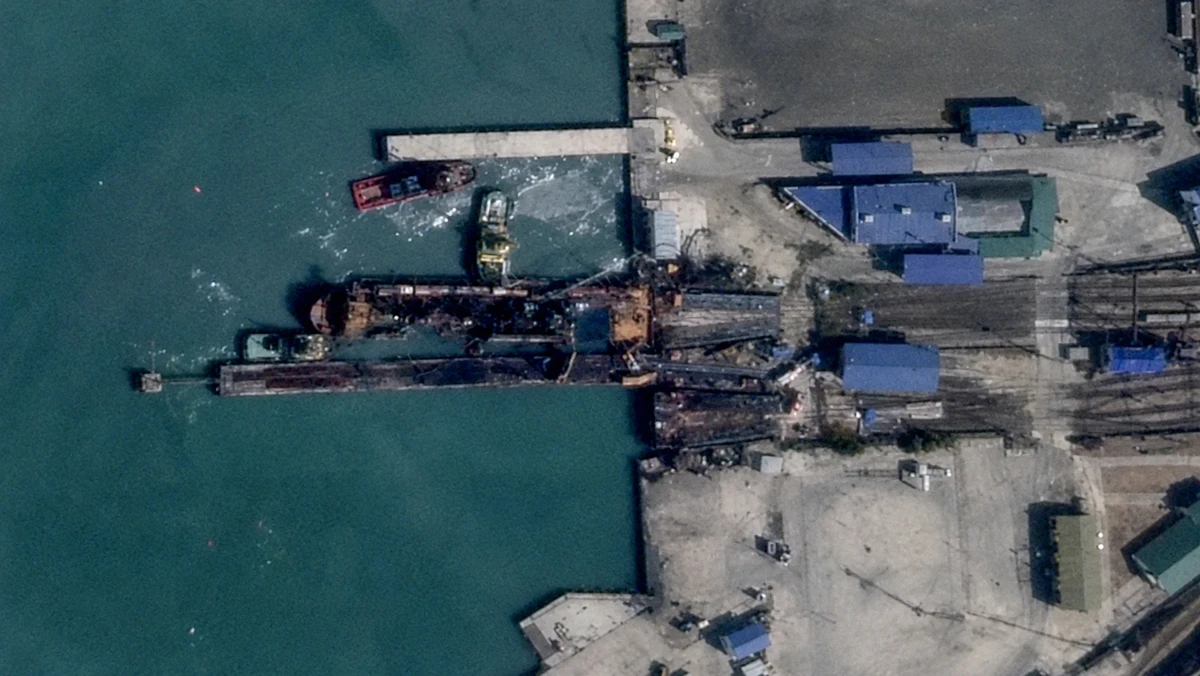 Satellite images and photos showing a fire on a destroyed ferry in the port of Kavkaz (slightly enhanced with AI)