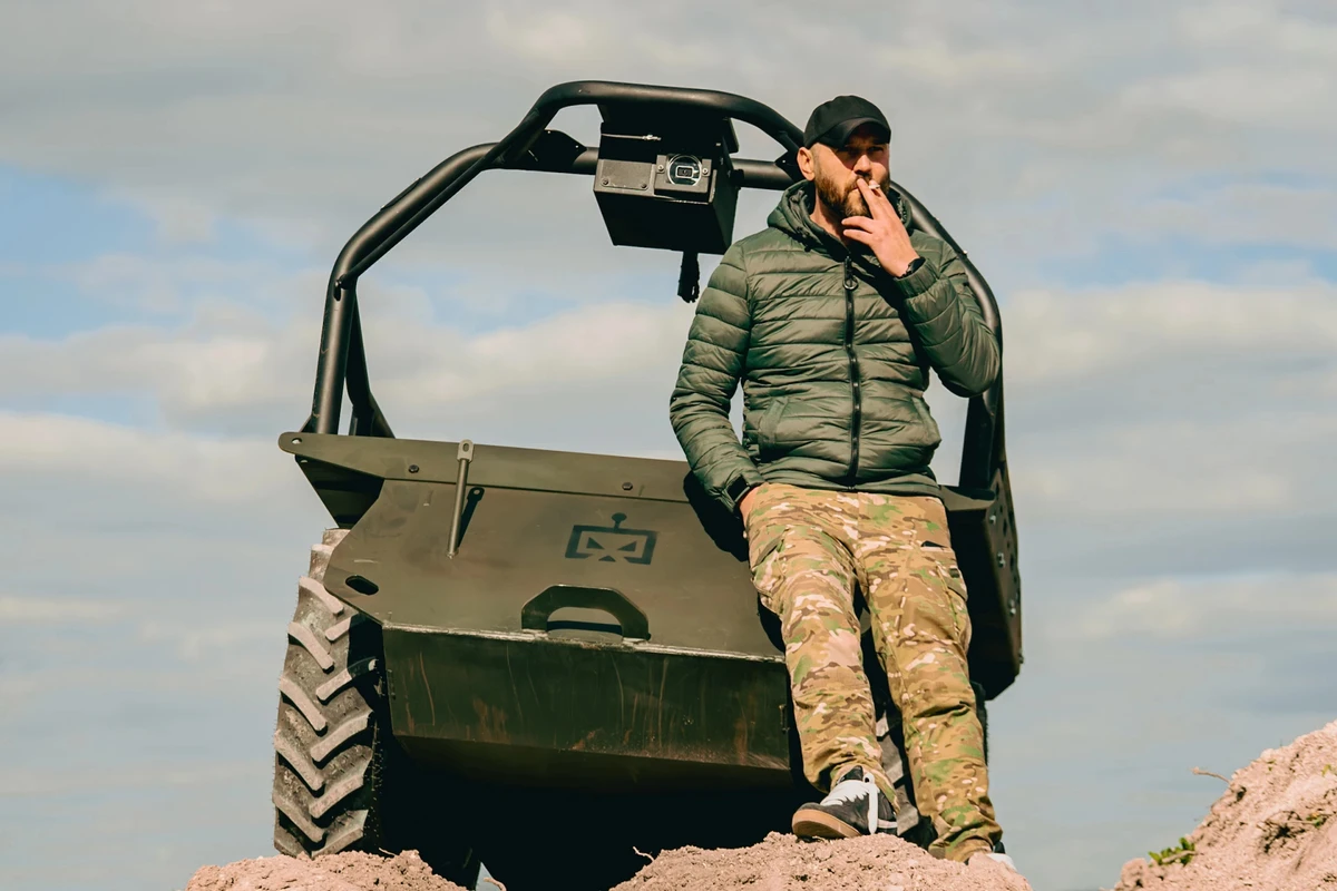 Rovertech director Vasyl Korenovskyi alongside a Zmii ground drone