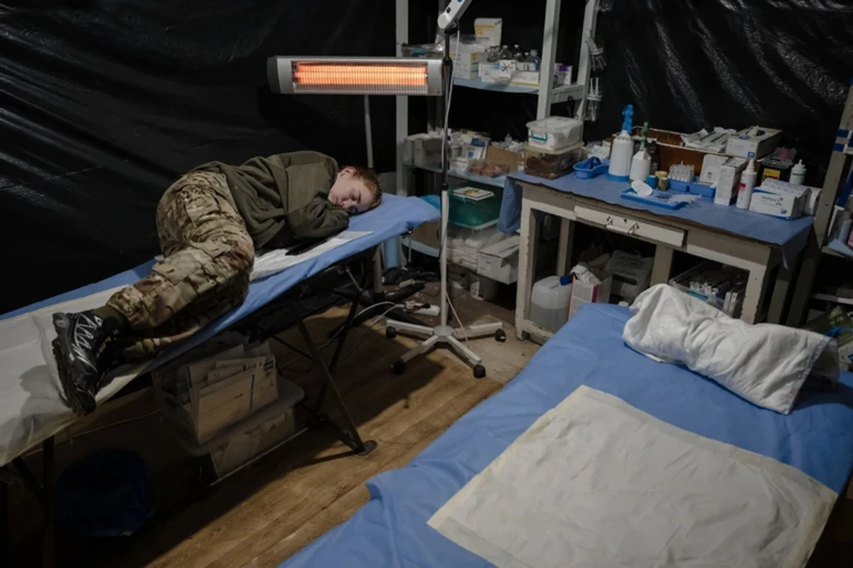 A sleeping female military medic.